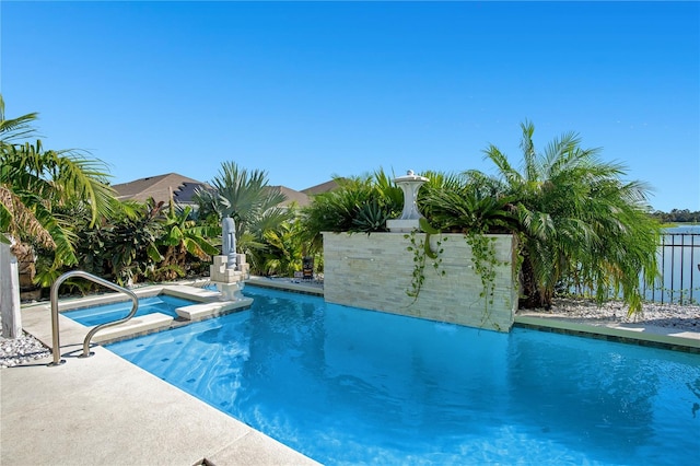 view of pool with an in ground hot tub