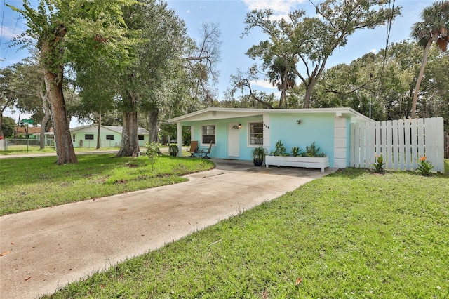 ranch-style house with a front lawn