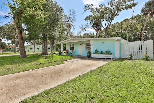 ranch-style home featuring a front yard