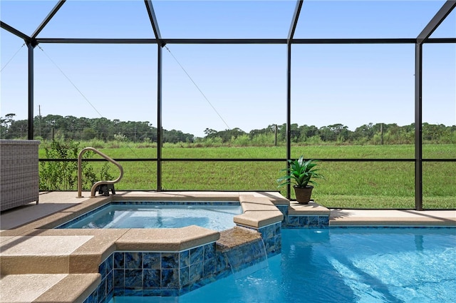 view of pool featuring glass enclosure, pool water feature, and an in ground hot tub