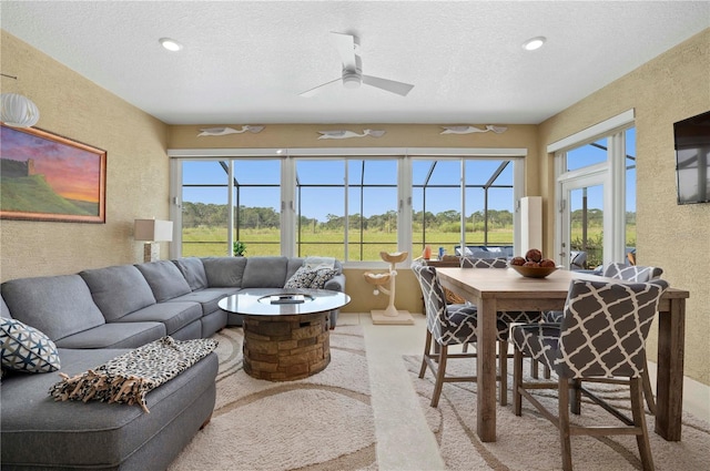 sunroom / solarium with ceiling fan