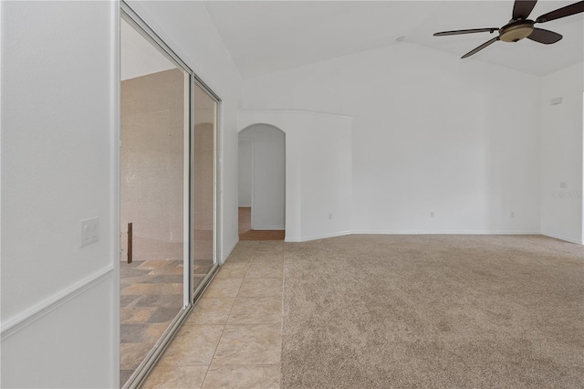 spare room with vaulted ceiling and ceiling fan