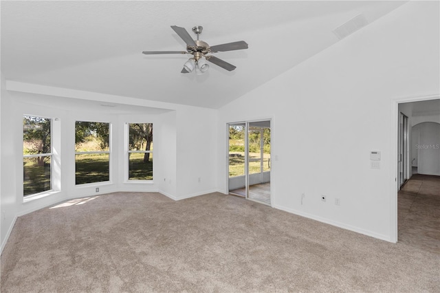 unfurnished living room featuring ceiling fan, light colored carpet, and high vaulted ceiling