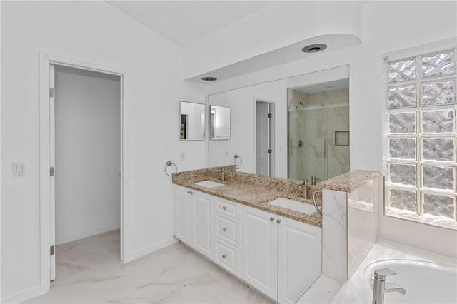 bathroom with vanity, separate shower and tub, and vaulted ceiling