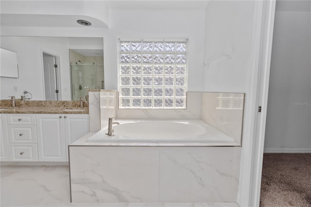 bathroom featuring vanity and plus walk in shower