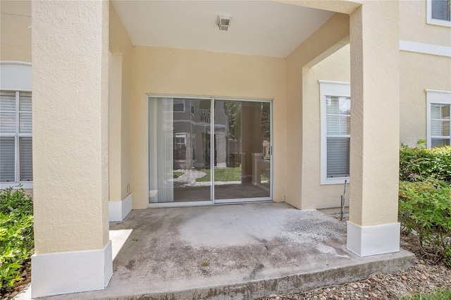 doorway to property featuring a patio