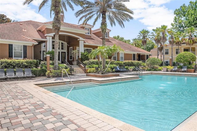 view of pool featuring a patio area