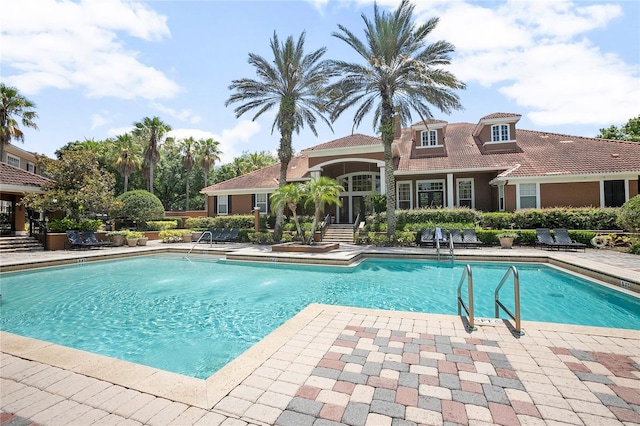 view of swimming pool featuring a patio