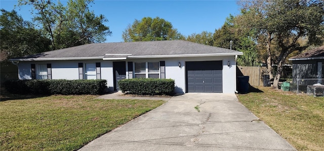 single story home with a front yard, fence, driveway, an attached garage, and stucco siding