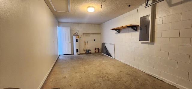 basement with electric panel, electric water heater, a textured ceiling, concrete block wall, and baseboards