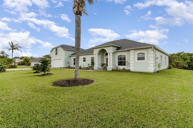 929 Hialeah St, Rockledge, FL 32955 - view of front facade featuring a shingled roof, a front yard, and stucco siding