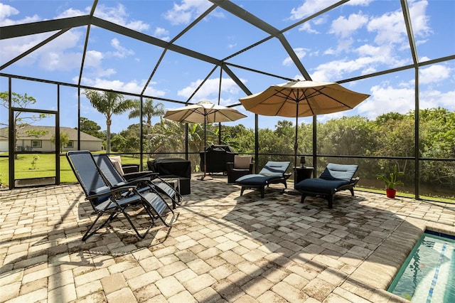 view of patio / terrace featuring glass enclosure