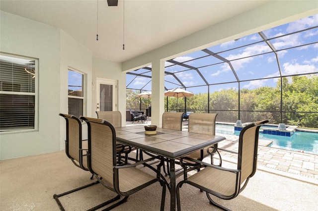 view of patio featuring a lanai