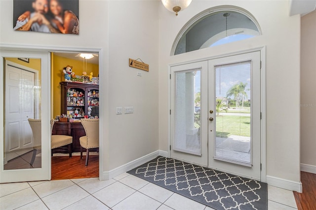 tiled entrance foyer featuring french doors