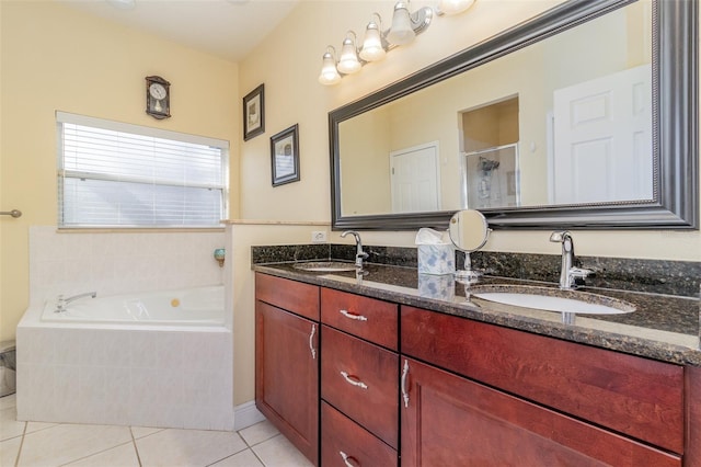 929 Hialeah St, Rockledge, FL 32955 - full bathroom featuring a shower stall, a garden tub, tile patterned flooring, and a sink