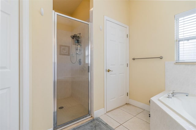 bathroom featuring independent shower and bath and tile patterned floors