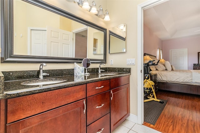 bathroom with vanity and hardwood / wood-style flooring