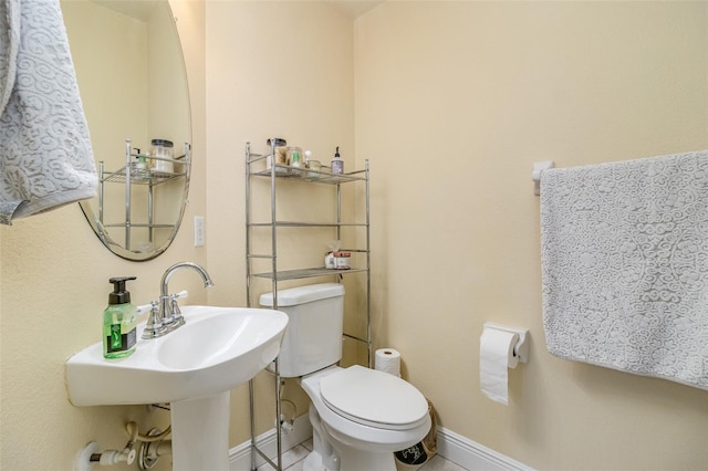 bathroom featuring toilet and tile patterned floors