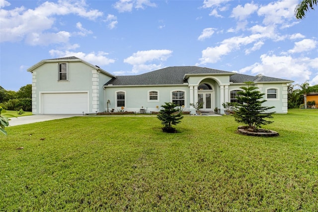 929 Hialeah St, Rockledge, FL 32955 - view of front of property with french doors, driveway, a garage, a front yard, and stucco siding