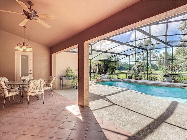 view of swimming pool featuring glass enclosure, ceiling fan, and a patio