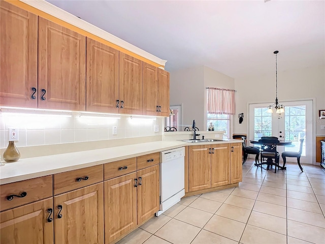 kitchen with dishwasher, pendant lighting, light tile patterned floors, and sink