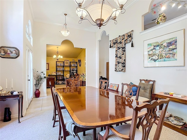 dining space featuring light tile patterned flooring, crown molding, and an inviting chandelier