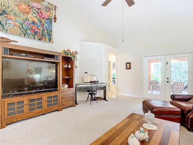 carpeted living room featuring ceiling fan, french doors, and high vaulted ceiling