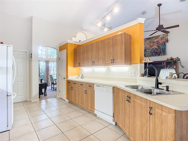 kitchen featuring light tile patterned floors, white appliances, ceiling fan, and sink