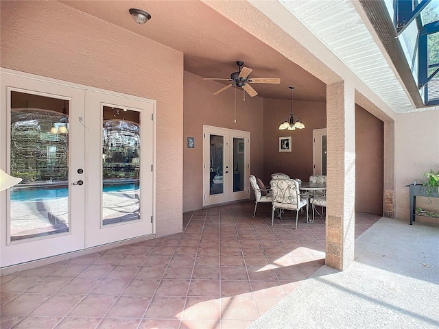 view of patio / terrace featuring ceiling fan and french doors