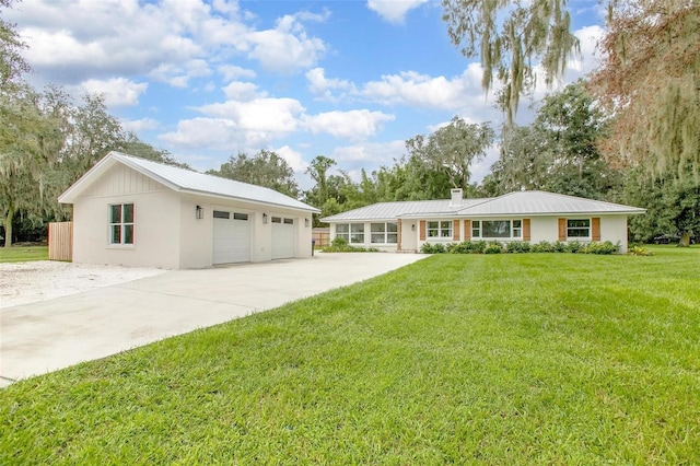 single story home featuring a front lawn and a garage