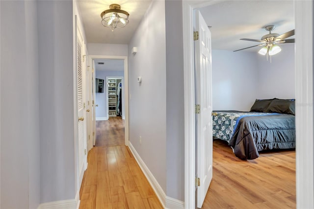 hallway featuring light wood-type flooring