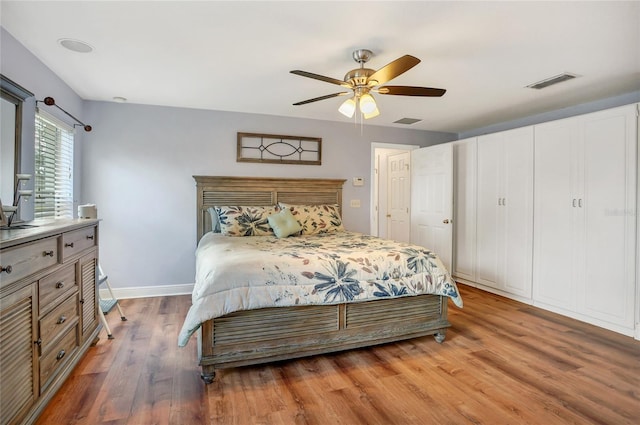 bedroom with wood-type flooring and ceiling fan