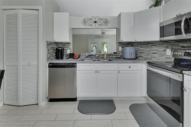 kitchen featuring white cabinetry, sink, and stainless steel appliances