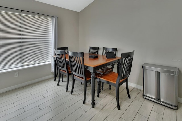 dining room featuring light hardwood / wood-style flooring and plenty of natural light