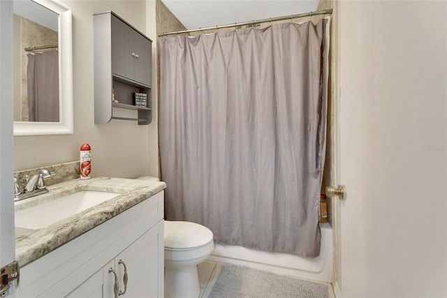 full bathroom featuring tile patterned flooring, vanity, toilet, and shower / bath combo with shower curtain