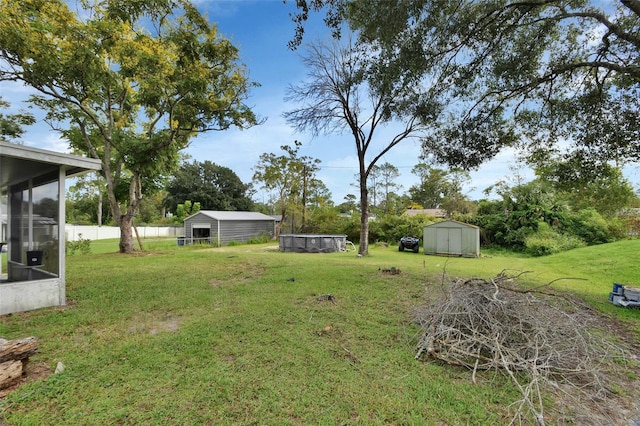 view of yard with a storage unit