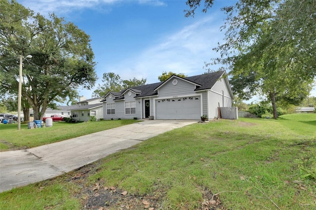 ranch-style house with a garage and a front lawn