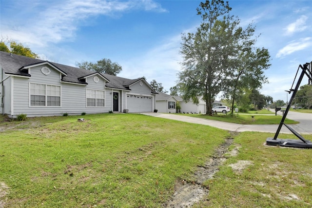 single story home with a garage and a front lawn