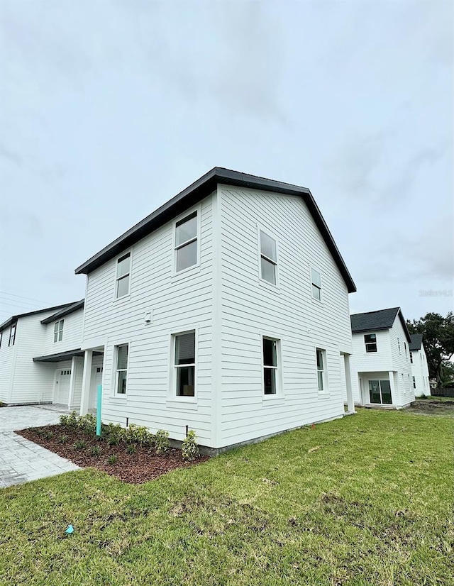 view of home's exterior with a lawn