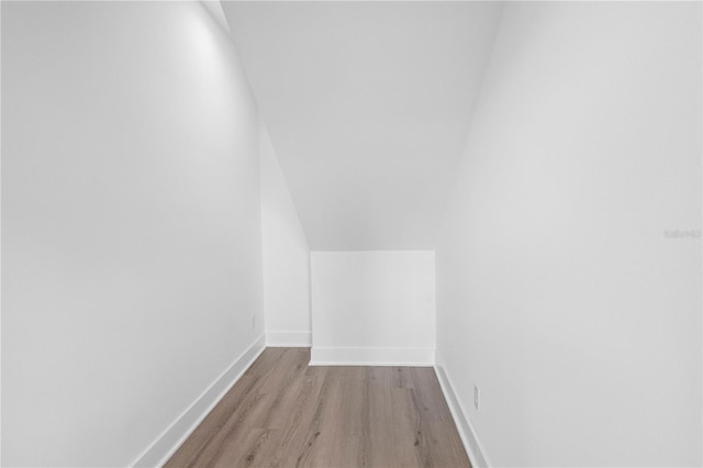 interior space featuring light hardwood / wood-style flooring and lofted ceiling