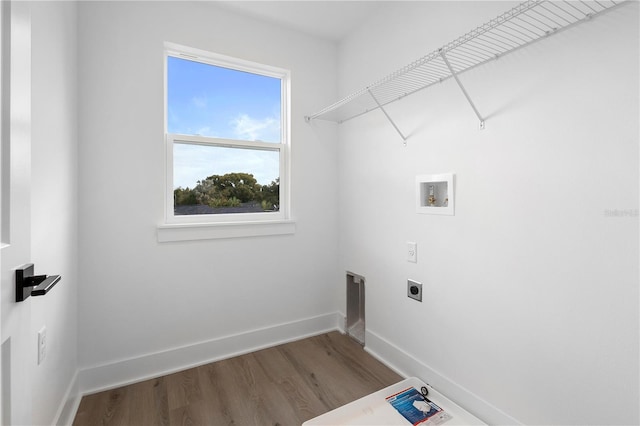 laundry area with electric dryer hookup, washer hookup, and hardwood / wood-style flooring