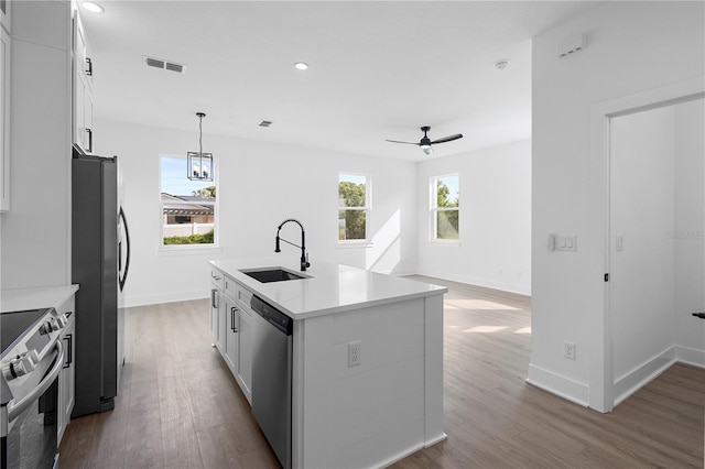 kitchen featuring sink, stainless steel appliances, light hardwood / wood-style floors, a kitchen island with sink, and white cabinets