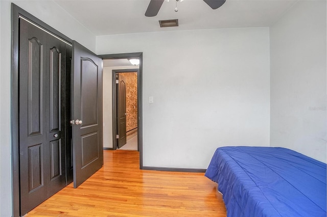 bedroom featuring light hardwood / wood-style flooring and ceiling fan