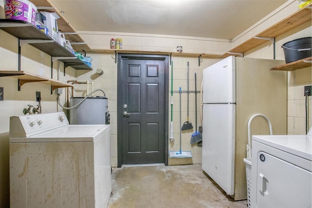 washroom with water heater and washer hookup