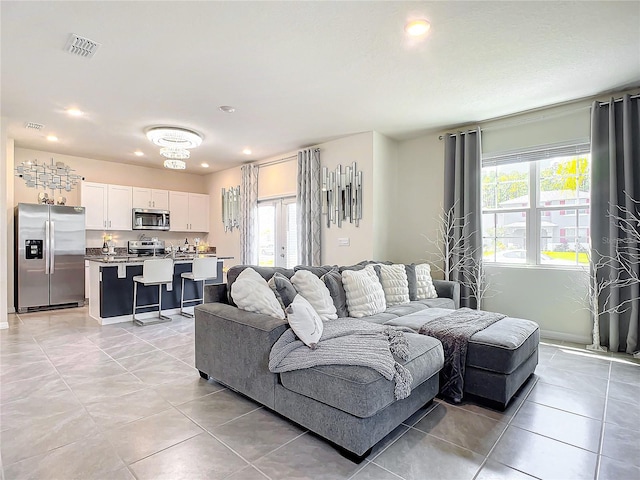 tiled living room featuring plenty of natural light