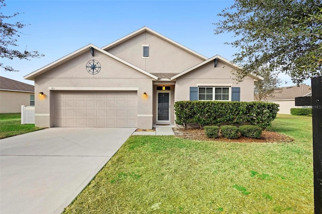 view of front of home featuring a garage and a front yard