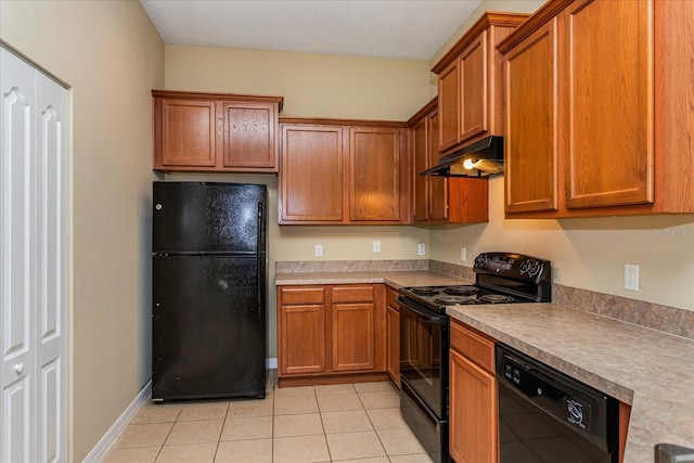 kitchen with black appliances and light tile patterned floors