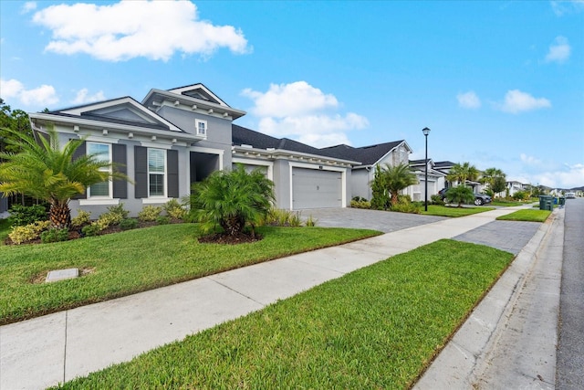 view of front facade featuring a front lawn and a garage