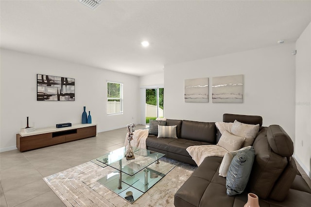 living room with light tile patterned floors