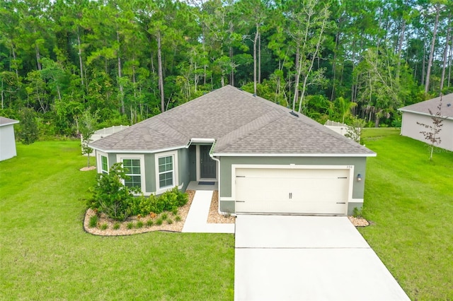 view of front of home featuring a garage and a front yard